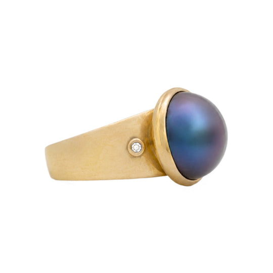 Gold ring with a blue gemstone 